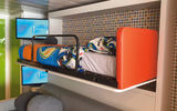 The kids' sleeping area in the Ultimate Family Suite features bunk beds and pull-out sofas.