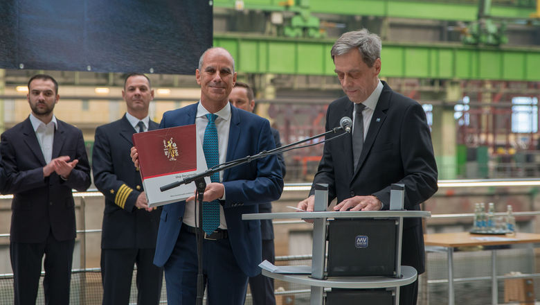 Jarmo Laakso (right), managing director of the Werften shipyard, hands over the Ravel to Crystal CEO Tom Wolber.