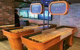 These shuffleboard games are part of the entertainment at Playmakers.
