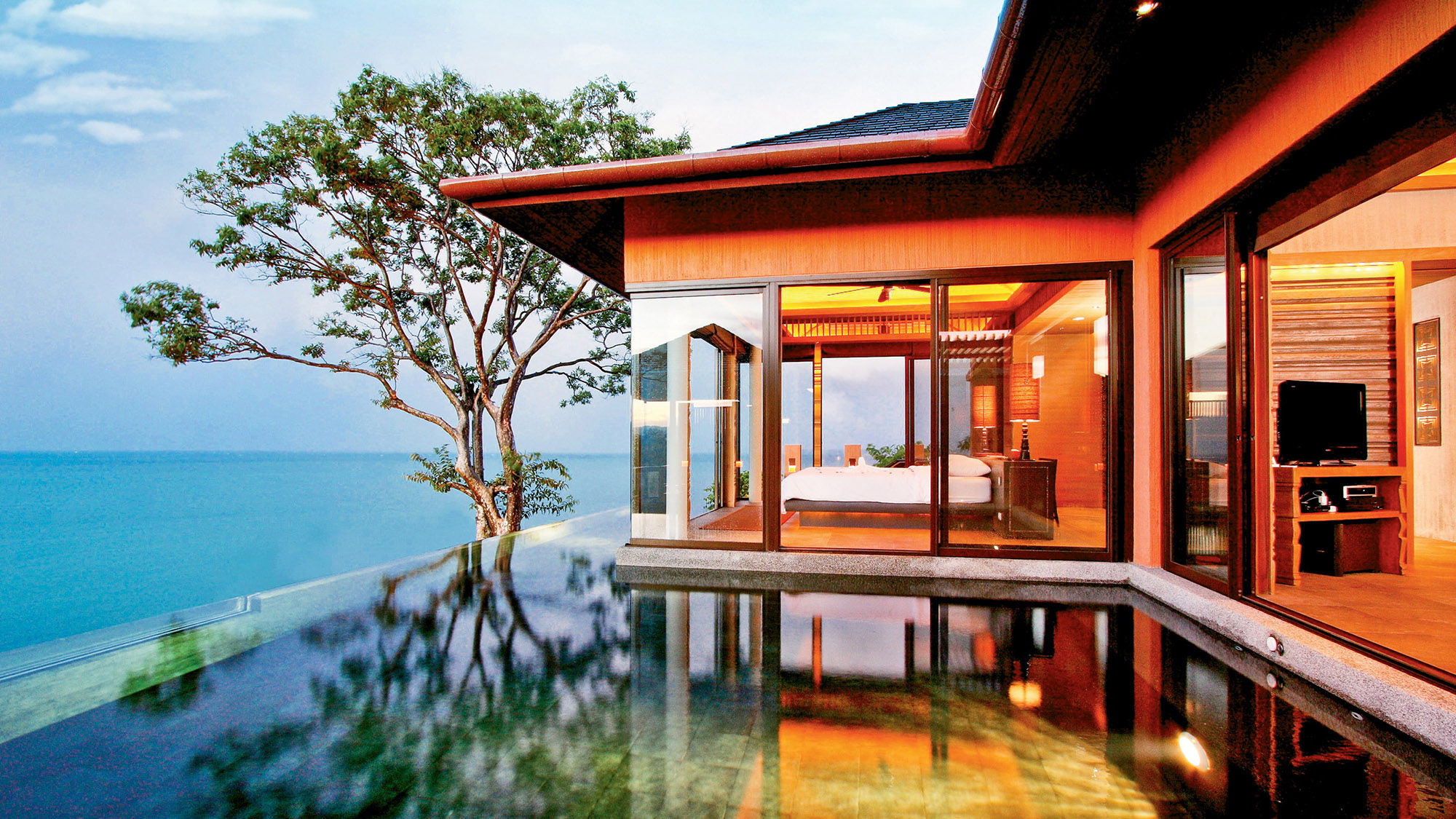 A pool villa at Sri Panwa. Amenities there include a private beach, tennis courts, muay thai boxing ring and six dining options.