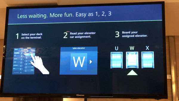 Video monitors explain the new elevator system.