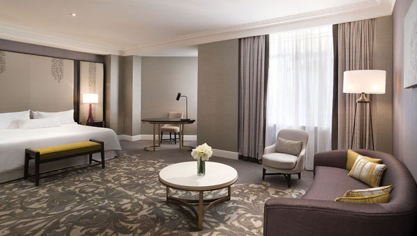 A junior suite at the Westin Palace with a sitting area ideal for enjoying hot chocolate.