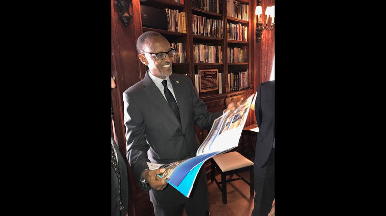 Rwandan president Paul Kagame reads the April 23, 2018 Travel Weekly cover story ''Rwanda Rising,'' about the making of Peter Greenberg's ''Rwanda -- The Royal Tour.'' He was in New York on April 24 for a screening of the film prior to its premiere on PBS.