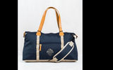 As carryon luggage goes, this bag has all the essentials and then some. Slightly below the max carryon size limit, the United by Blue Trail Weekender's 100% recycled polyester finish, which comes in a variety of colors, is water repellant and stain resistant. The bag, which is equipped with a removable, adjustable crossbody strap as well as vegetable tanned leather carry handles with a nine-inch drop, has a padded laptop sleeve that can accommodate up to a 13-inch device.