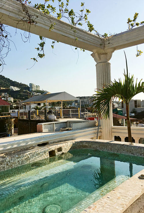 The Roman bath-style, 10-person whirlpool tub has views of the Zona Romantica. The Roman bath-style, 10-person whirlpool tub has views of the Zona Romantica.