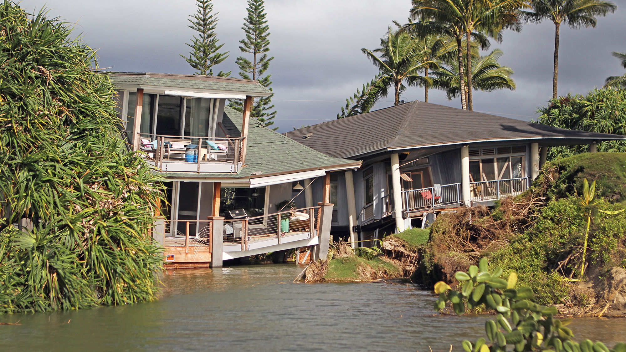 Damaged homes west of Hanalei Pier in Kauai after record rains and flooding in April.