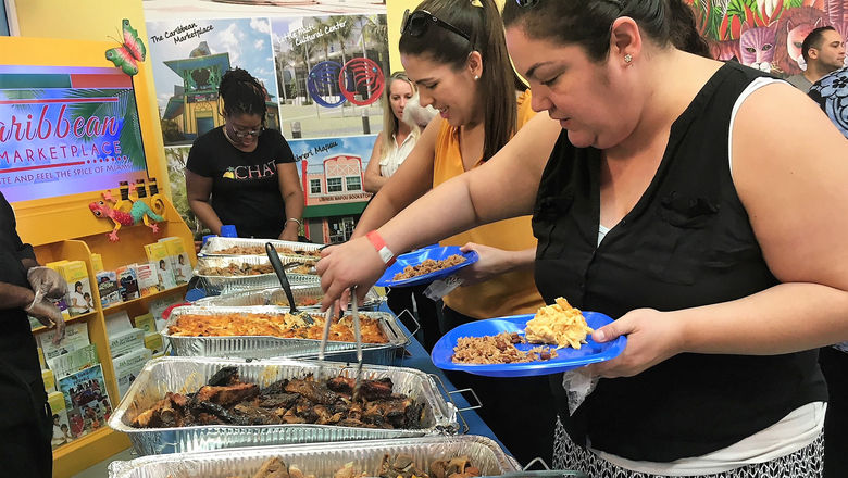 Tour guests help themselves to a Southern food buffet during one of the city's new cultural tours.