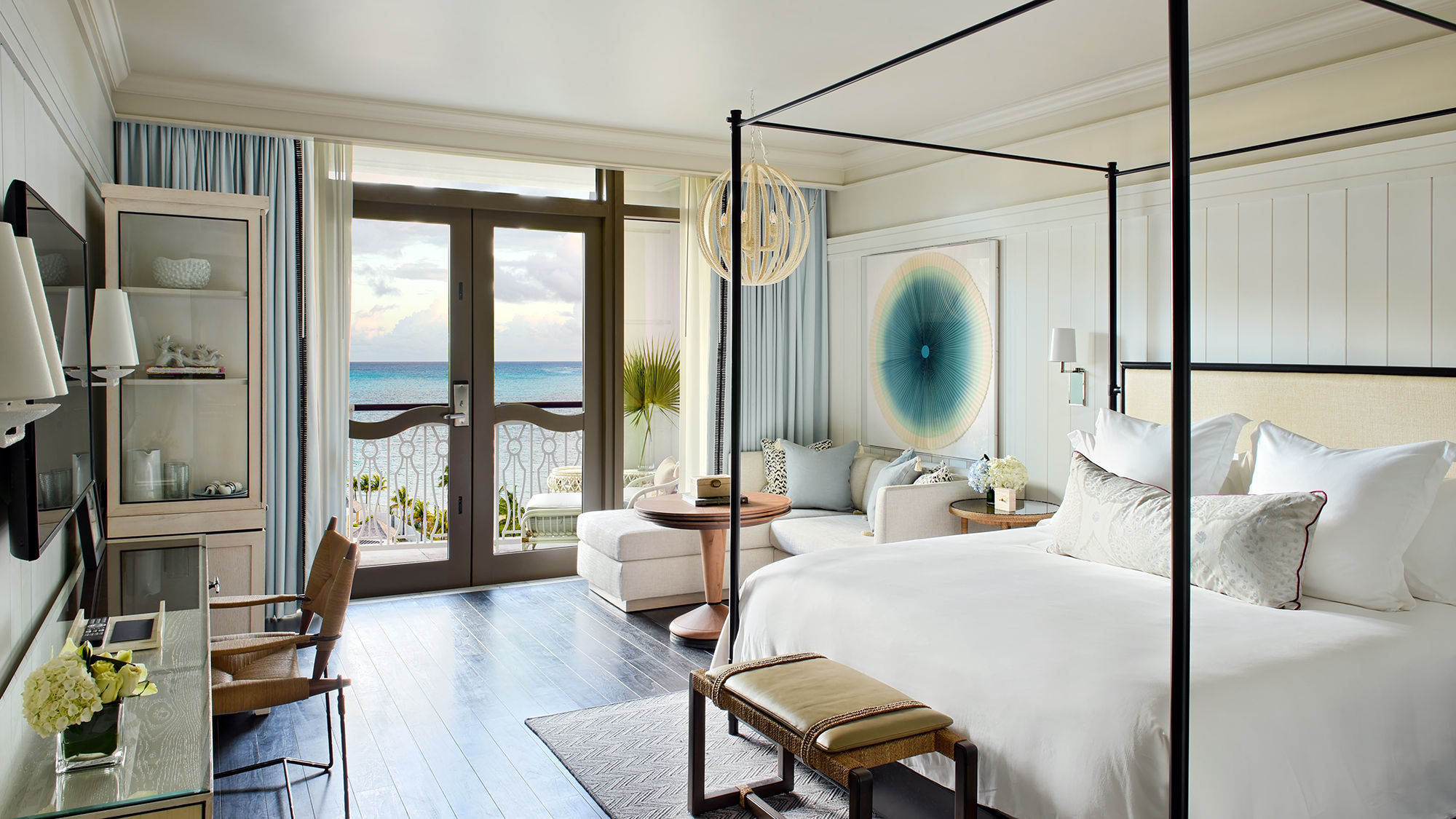 Rooms are outfitted in blues, corals and lavenders, with artwork by Bahamian artists.