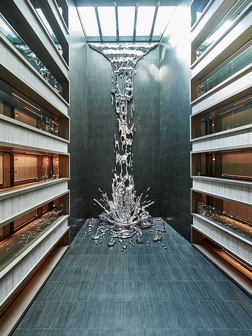 A sculpture at the VP Plaza Espana Design was created to look as if water was cascading from the outdoor pool to the lobby below. A sculpture at the VP Plaza Espana Design was created to look as if water was cascading from the outdoor pool to the lobby below.