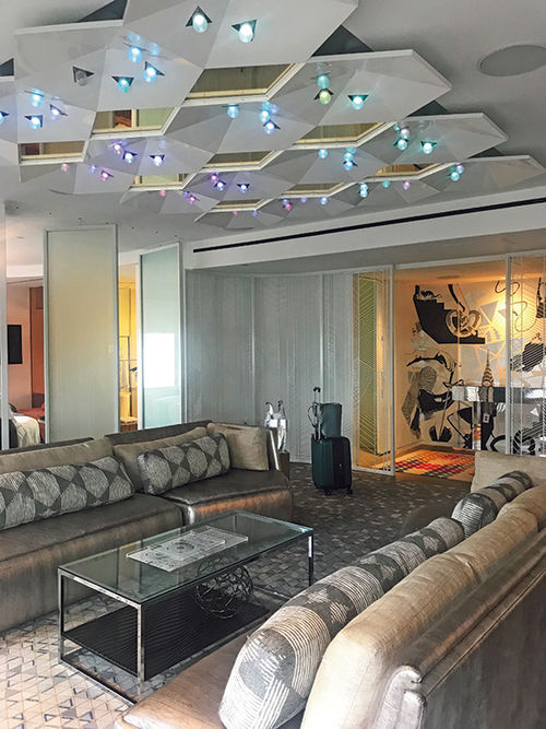 The Wow suite at the W Times Square features silver couches and ceiling mirrors and lights that give a nod to the New Year's Eve ball drop. The Wow suite at the W Times Square features silver couches and ceiling mirrors and lights that give a nod to the New Year's Eve ball drop.