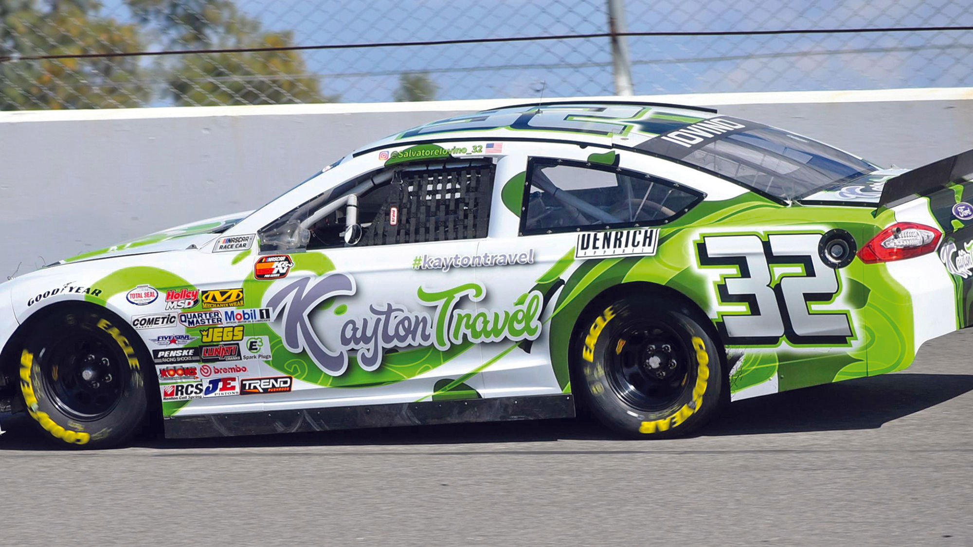 Kayton Travel's logo prominently displayed on Salvatore Iovino's car.