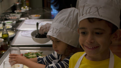 Max, 6, and Roxy, 4, the reporter's children, cook up something good during a pizza-making party at the JW Marriott Essex House.
