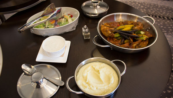 An in-room family-style dinner of oven-roasted organic chicken with rainbow veggies and mashed potatoes at the JW Marriott Essex House. An in-room family-style dinner of oven-roasted organic chicken with rainbow veggies and mashed potatoes at the JW Marriott Essex House.