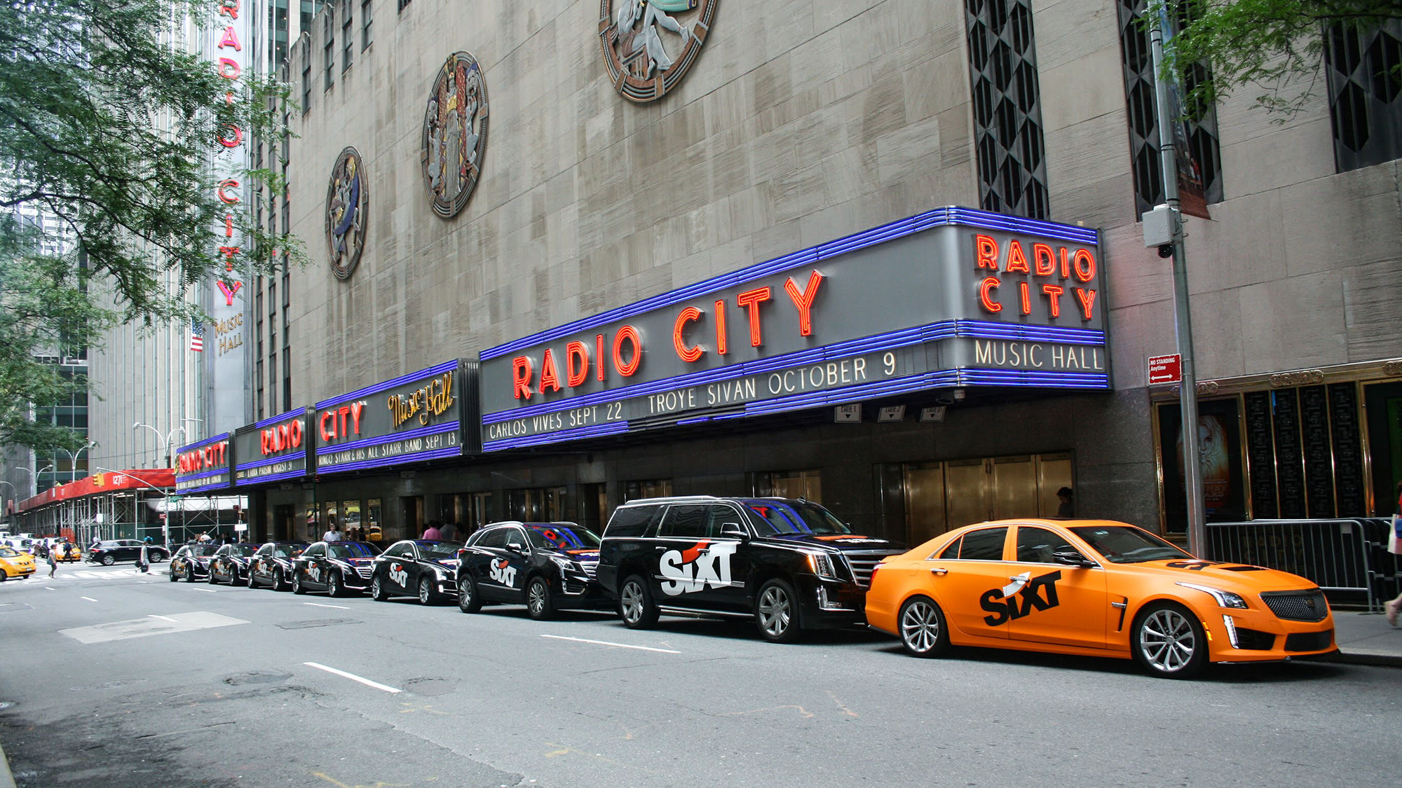 A promotional event in New York featured Sixt-branded cars on Sixth Avenue.