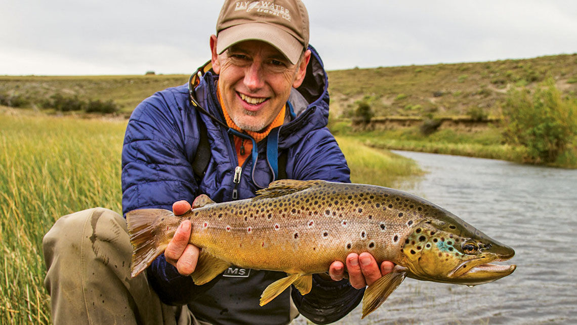 Brian Gies, co-owner of Fly Water Travel in Ashland, Ore., with a brown trout in Chile.