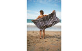 Let the towel wars begin. Tesalate Beach Towels beach towels, which measure 63 by 31 inches, come in a variety of colors and striking designs. Fast-drying, light weight and staying virtually sand free, the products are super absorbent: According to the manufacturer, a Tesalate beach towel can absorb up to 34 ounces of water. As for being travel friendly, the towel can be rolled up and fit in an accompanying compact bag.