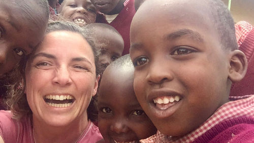 The author takes a selfie with some local schoolchildren. The author takes a selfie with some local schoolchildren.