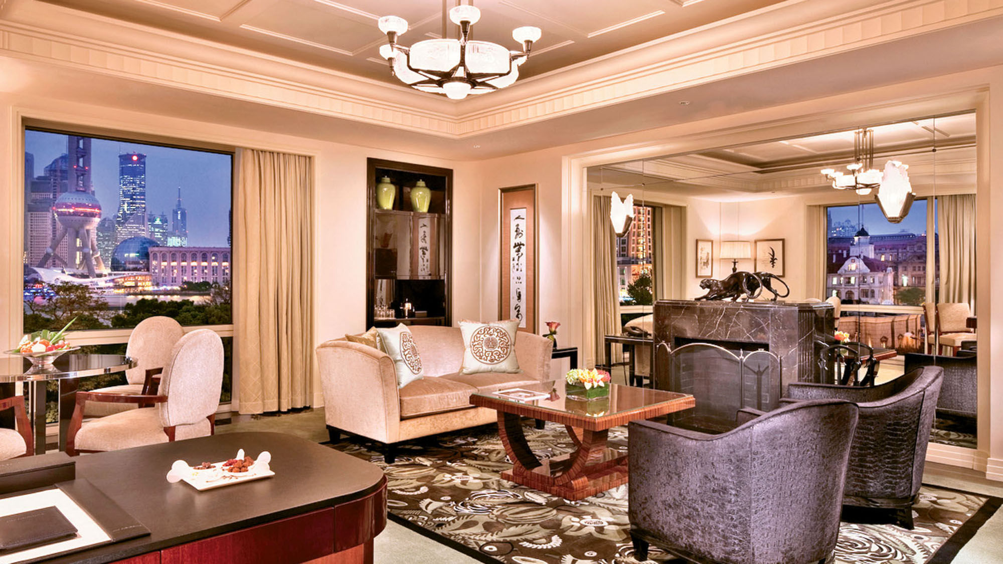 The living room in the 1,345-square-foot Grand Deluxe River Suite, which features a fireplace.