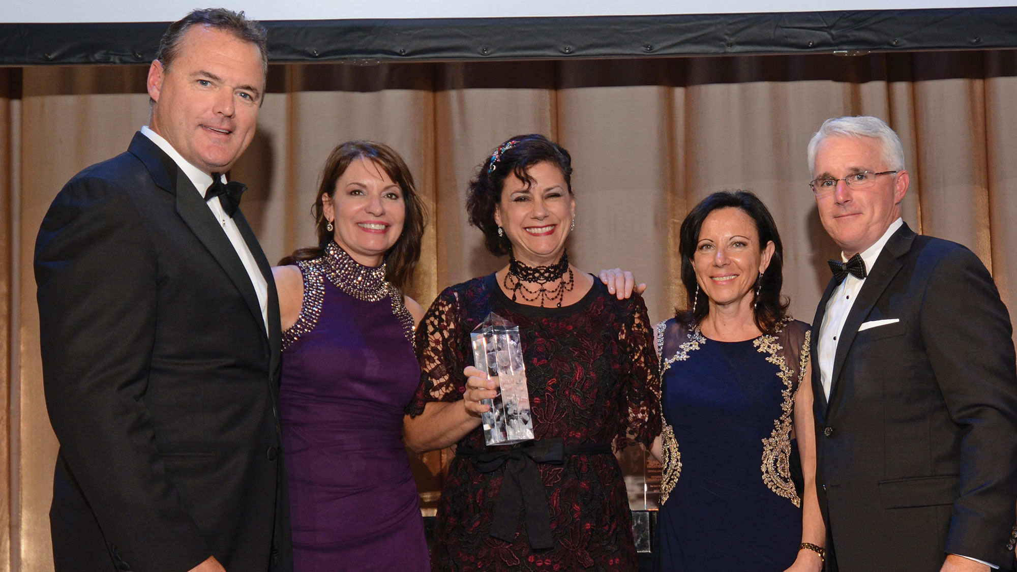 Tim Mullen (far left) at Apple Vacations' annual awards gala in 2017. Apple Leisure Group COO of distribution Jeff Mullen, Tim's brother, is on the right.