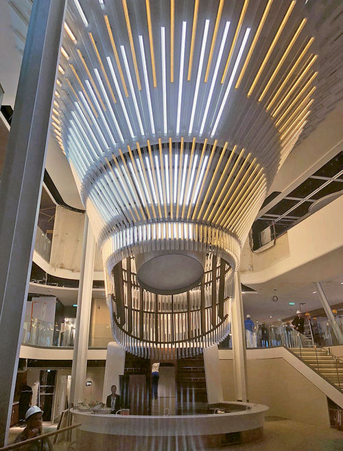 A modern chandelier dominates the Grand Plaza on Celebrity Edge. A modern chandelier dominates the Grand Plaza on Celebrity Edge.