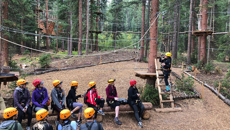 Some attendees participated in a ropes course at Lost Forest in Snowmass, Colo.