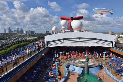 The blimp hovers over a Carnival ship during its seven-state tour. The blimp hovers over a Carnival ship during its seven-state tour.