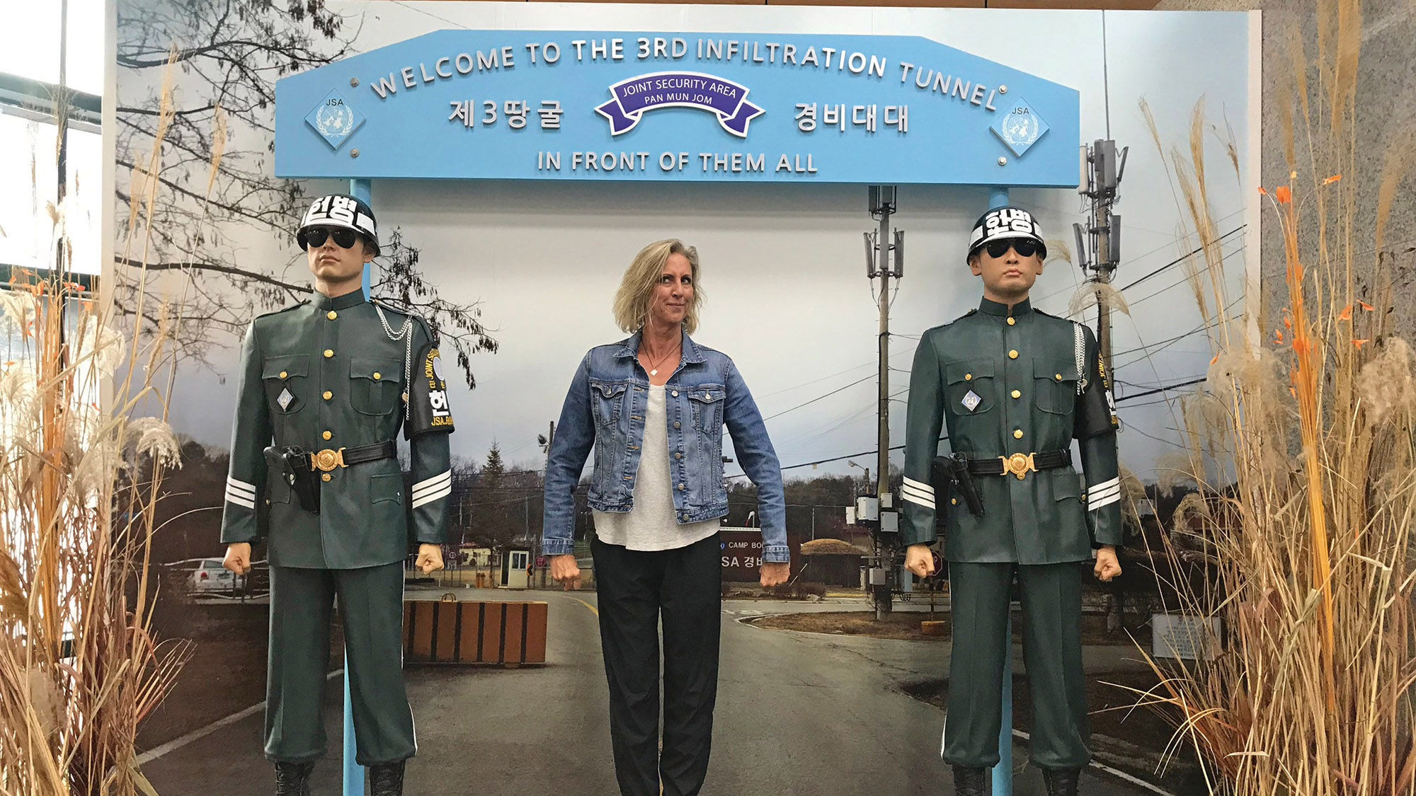 The author posing with life-size figures at the Third Infiltration Tunnel in the Demilitarized Zone.