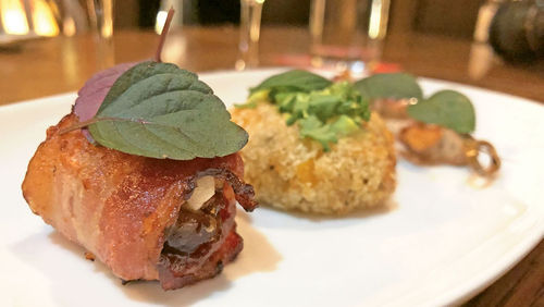 Sample bites at the Irish Heather Gastropub included bacon-wrapped dates and crab cakes. Sample bites at the Irish Heather Gastropub included bacon-wrapped dates and crab cakes.