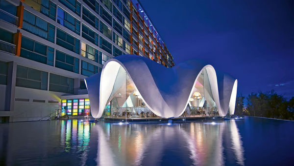 The resort’s clamshell-shaped Perla restaurant sits on a reflecting pool.
