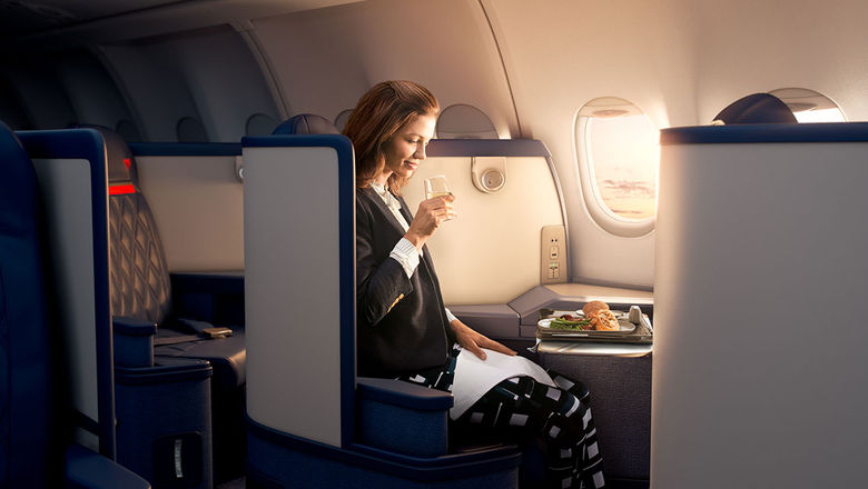 A passenger in a Delta One business class suite, a product offered on international and transcontinental long-haul flights.