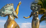 The Triton and Mermaid statue along the Malecon.