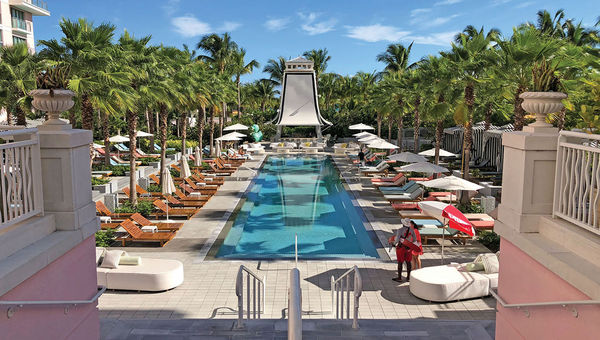 The SLS Baha Mar’s Bungalow Pool Bar & Grill offers signature cocktails and food.