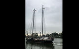 A sailing ship setting out from the picturesque northern port town of the northern port town of Enkhuizen, which has become a favored Dutch tourist destination.