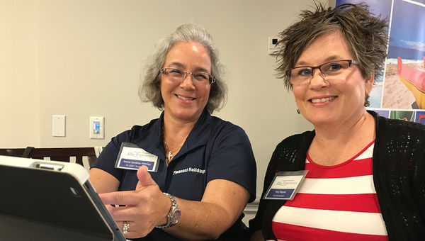 Pleasant Holidays' Maria Landrau-Mackey (left) demonstrates the tour company's new Hotel Recommendation tool to AAA Reading-Berks travel consultant Amy Kepner. Pleasant Holidays' Maria Landrau-Mackey (left) demonstrates the tour company's new Hotel Recommendation tool to AAA Reading-Berks travel consultant Amy Kepner.