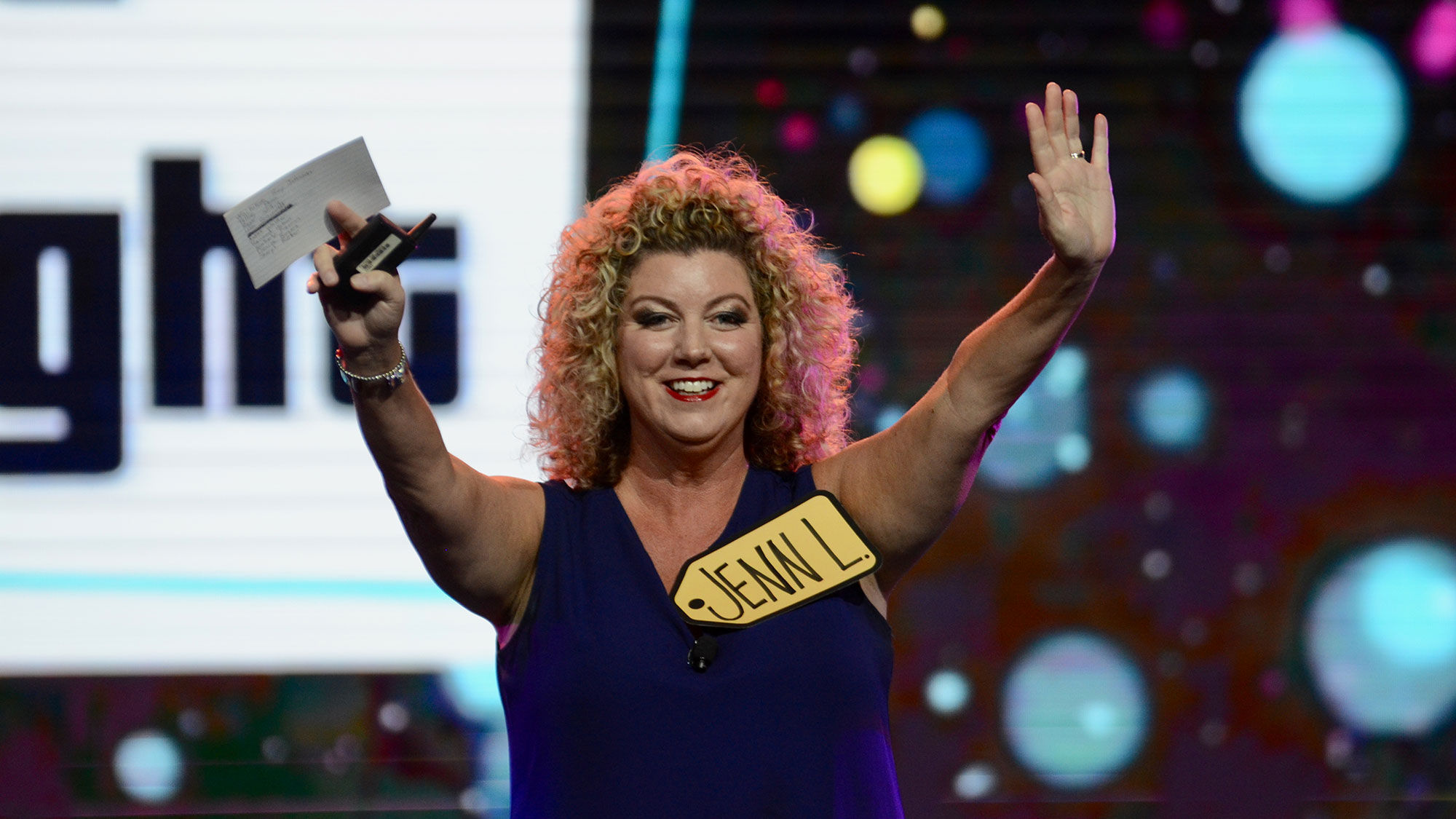 Travel Planners International's Jenn Lee introducing "The Price is Right" competition at CruiseWorld.