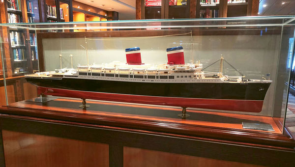 A scale model of the SS America is part of a memorabilia collection in the Pride of America's Library.