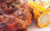 Jerk chicken with roast corn and other sides at Crackpot Kitchen.