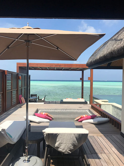 Deck and private infinity pool of one of the overwater villas at the Four Seasons Resorts Maldives at Kuda Huraa. Deck and private infinity pool of one of the overwater villas at the Four Seasons Resorts Maldives at Kuda Huraa.