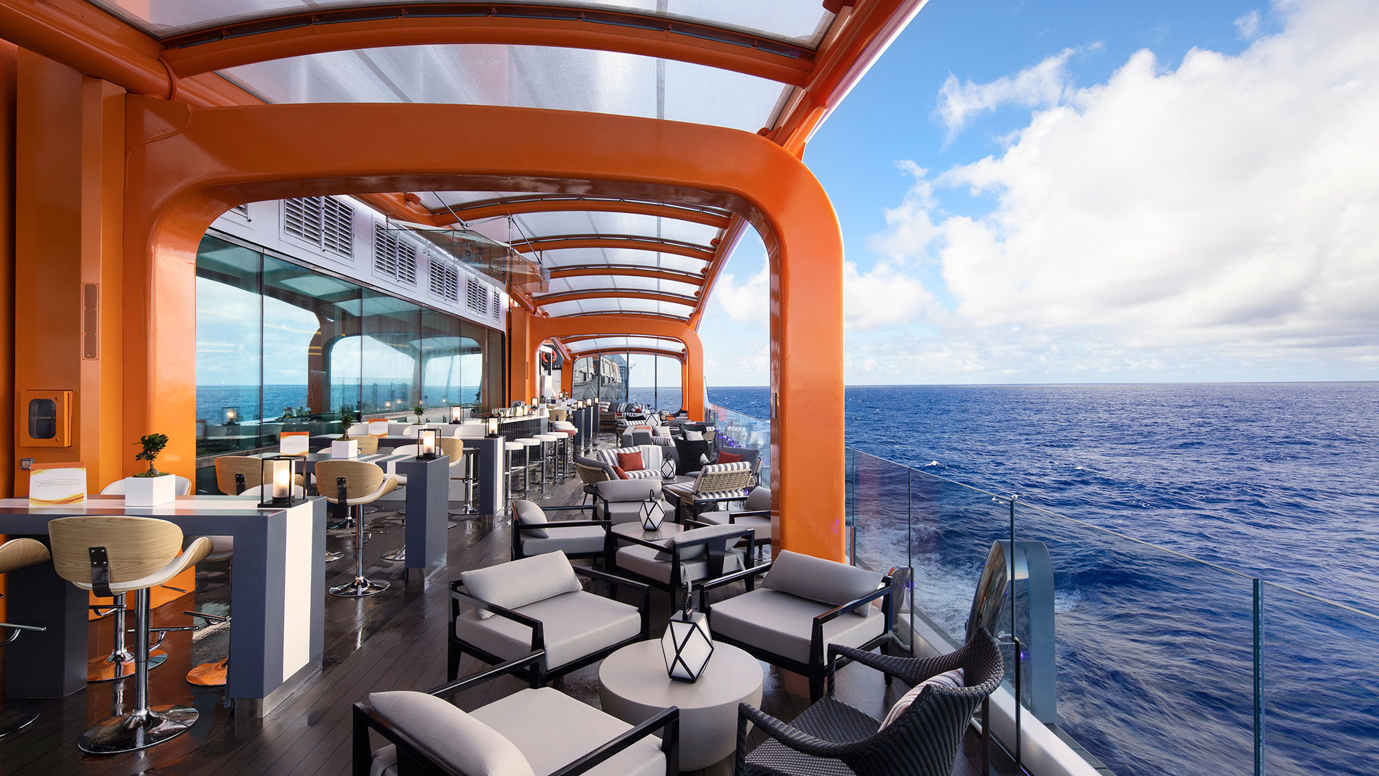 The highlight of Celebrity Edge's outward-facing vision, Magic Carpet is a cantilevered, moving platform that reaches a height of 13 stories above sea level.