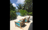 Outdoor relaxation area at spa at Four Seasons Resort Maldives Kuda Huraa.