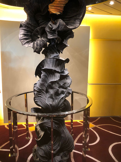 This sculpture, which spans two decks through an opening in the main dining room ceiling was inspired by sound waves. This sculpture, which spans two decks through an opening in the main dining room ceiling was inspired by sound waves.