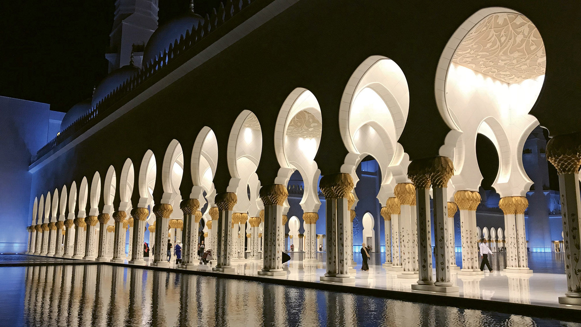 Arcades reflected in one of the pools on the grounds of the Sheikh Zayed Grand Mosque in Abu Dhabi.