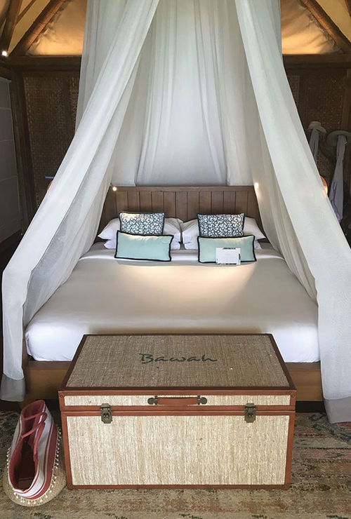 A beach suite bedroom at Bawah Reserve. The suite’s walls can be raised, all the better to enjoy the property’s natural beauty. But there’s also air conditioning for warmer nights. A beach suite bedroom at Bawah Reserve. The suite’s walls can be raised, all the better to enjoy the property’s natural beauty. But there’s also air conditioning for warmer nights.