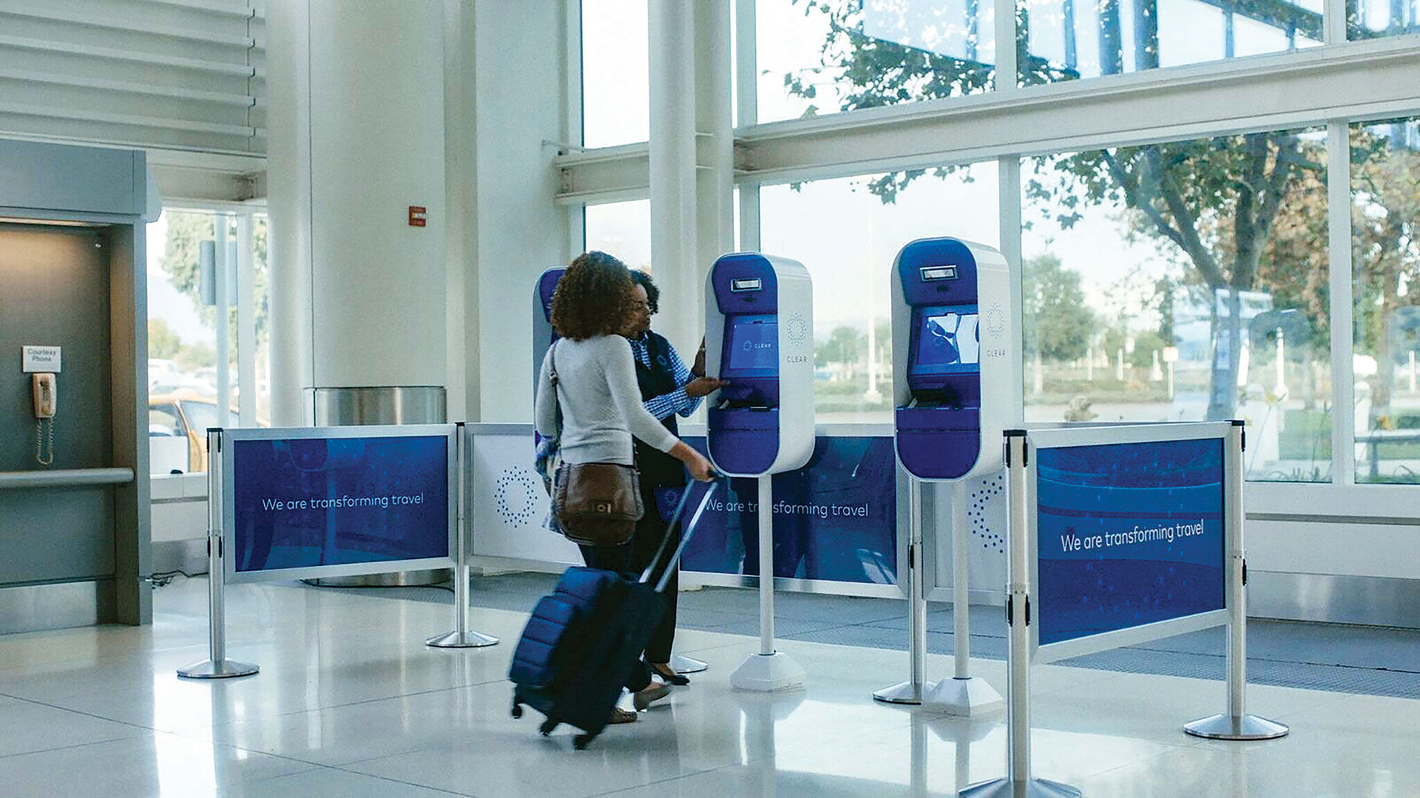 The Clear biometric machines at a TSA airport security checkpoint.