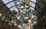 Need a little help getting in the holiday spirit? Check out our slideshow from the festive streets of London. Pictured, decorations in an open air shopping area in Covent Garden.
