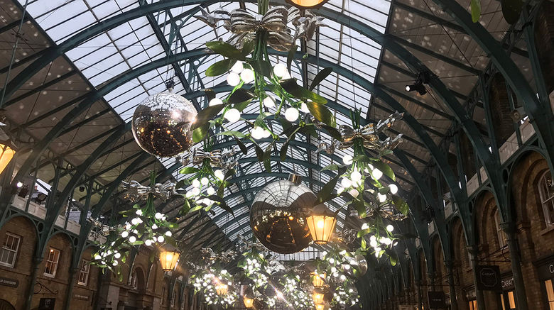 Need a little help getting in the holiday spirit? Check out our slideshow from the festive streets of London. Pictured, decorations in an open air shopping area in Covent Garden.