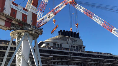 The funnel complex being hoisted into place on the Scarlet Lady.