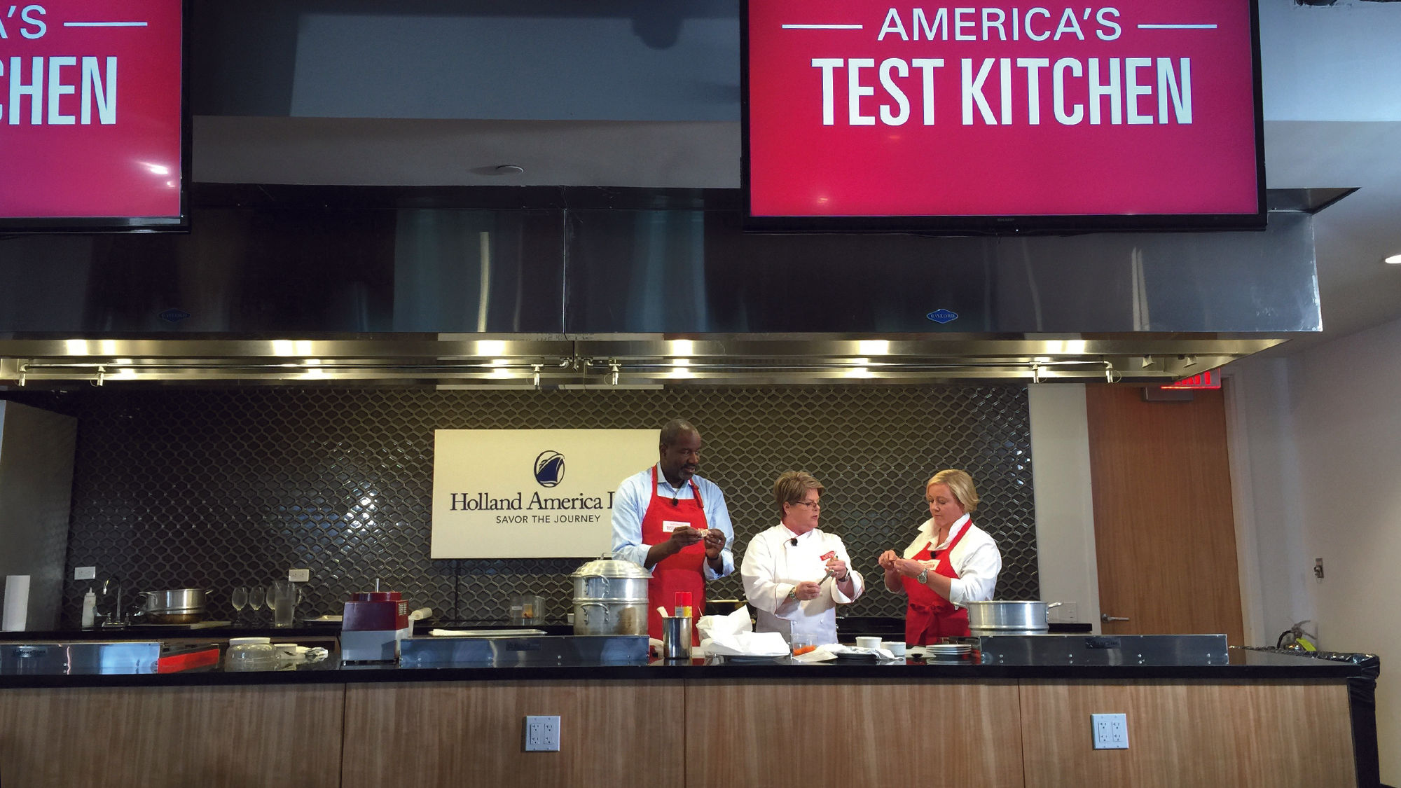Holland America Line president Orlando Ashford (left) on the America's Test Kitchen set.