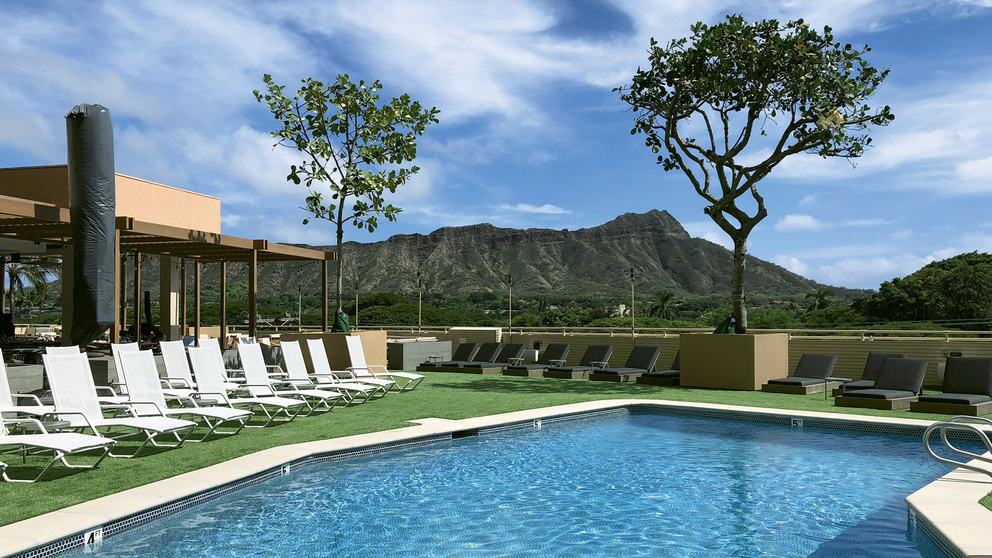 Diamond Head looms over the third-floor pool deck at the Queen Kapiolani Hotel.