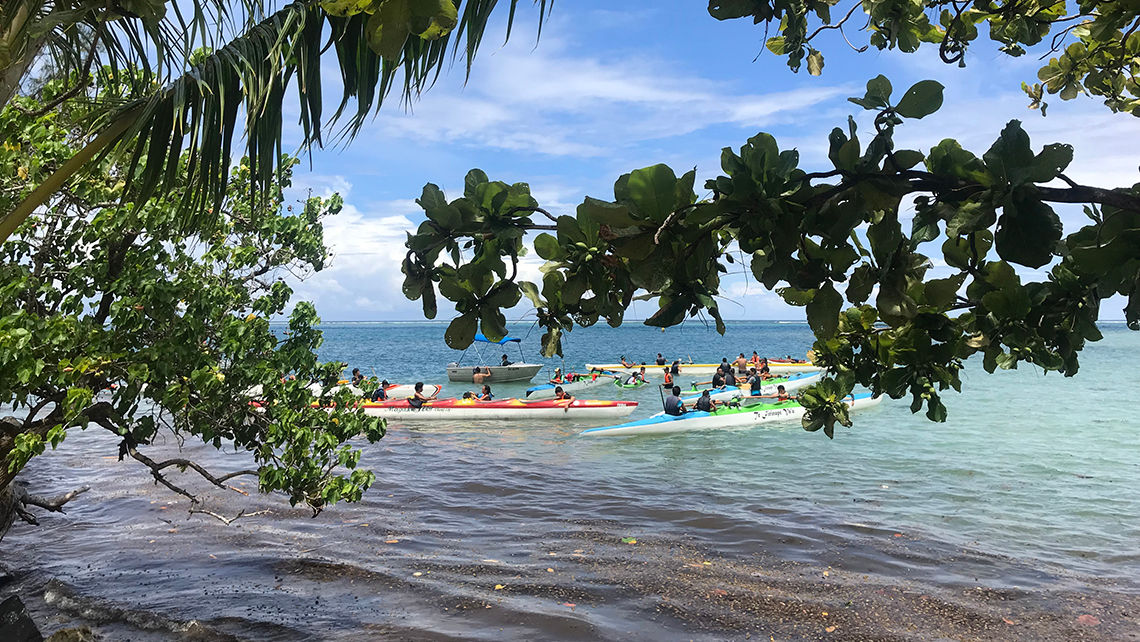 Islanders getting ready to take their outrigger canoes out for ride off Moorea.